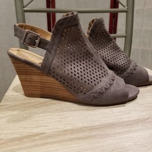 Report women's size 9.5 cut out open toe faux suede wedge with strap. Taupe